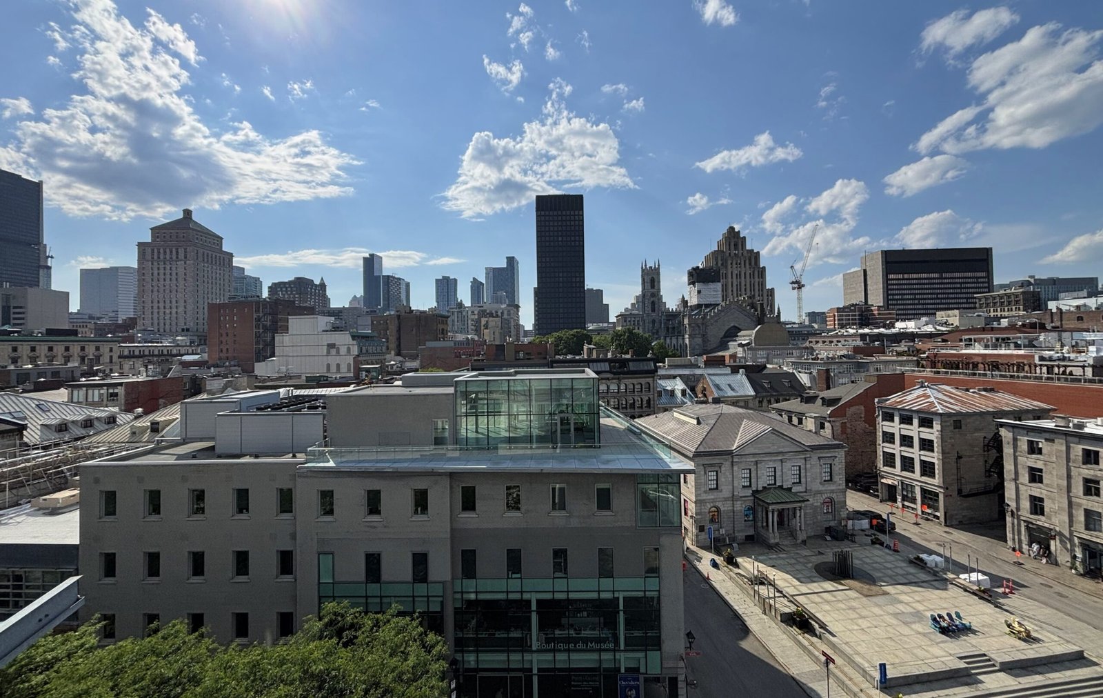 A wide view of downtown Montreal’s skyline taken from the rooftop of Pointe-à-Callière Museum.