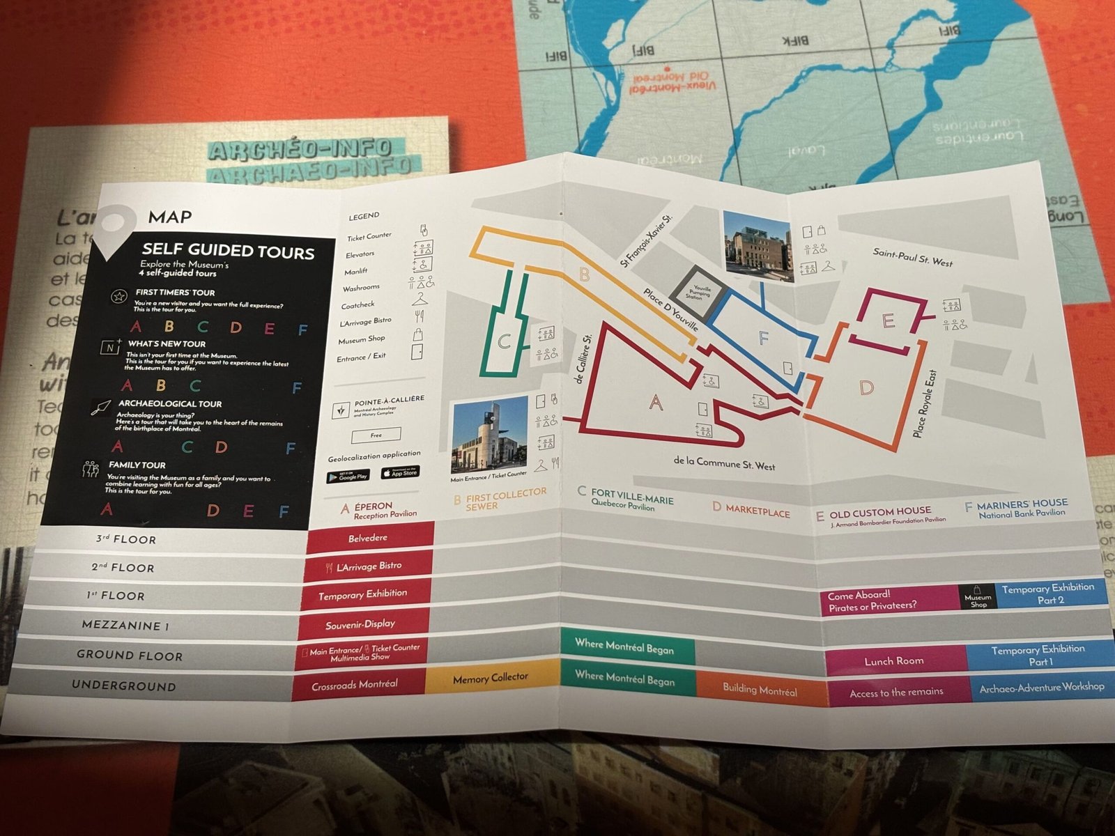 A folded map showing the self-guided tour layout of the Montreal Pointe-à-Callière Museum.