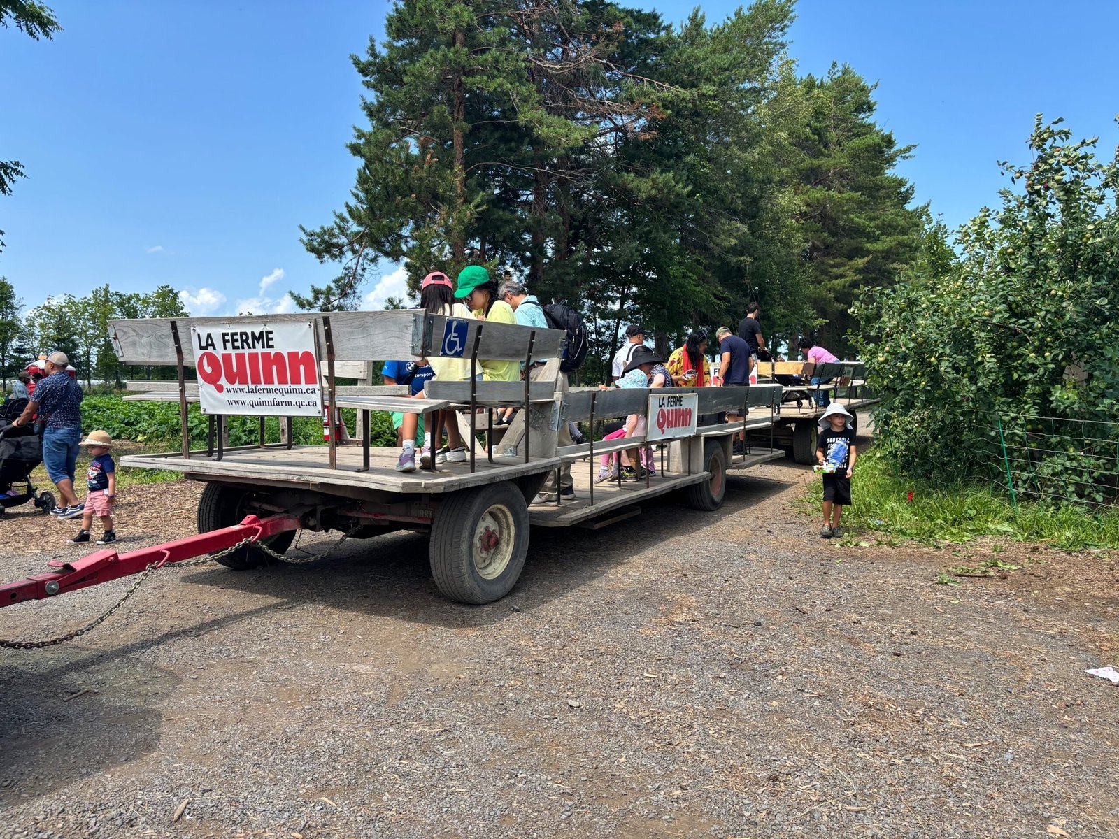 Quinn Farm tractor trailer with passengers boarding for the field ride.