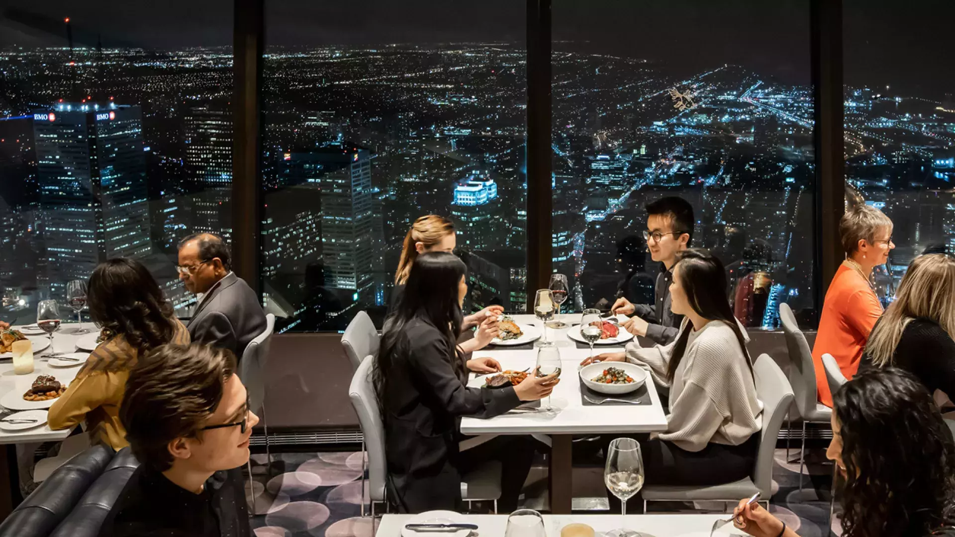 Guest having dinner at the 360 restaurant on top of the CN tower in Toronto
