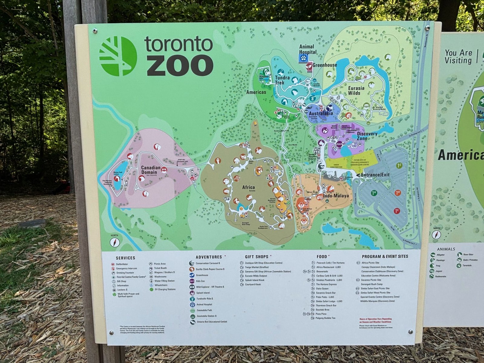 Map of the Toronto Zoo showing different regions like Africa, Canadian Domain, Tundra Trek, Indo-Malaya, and more.