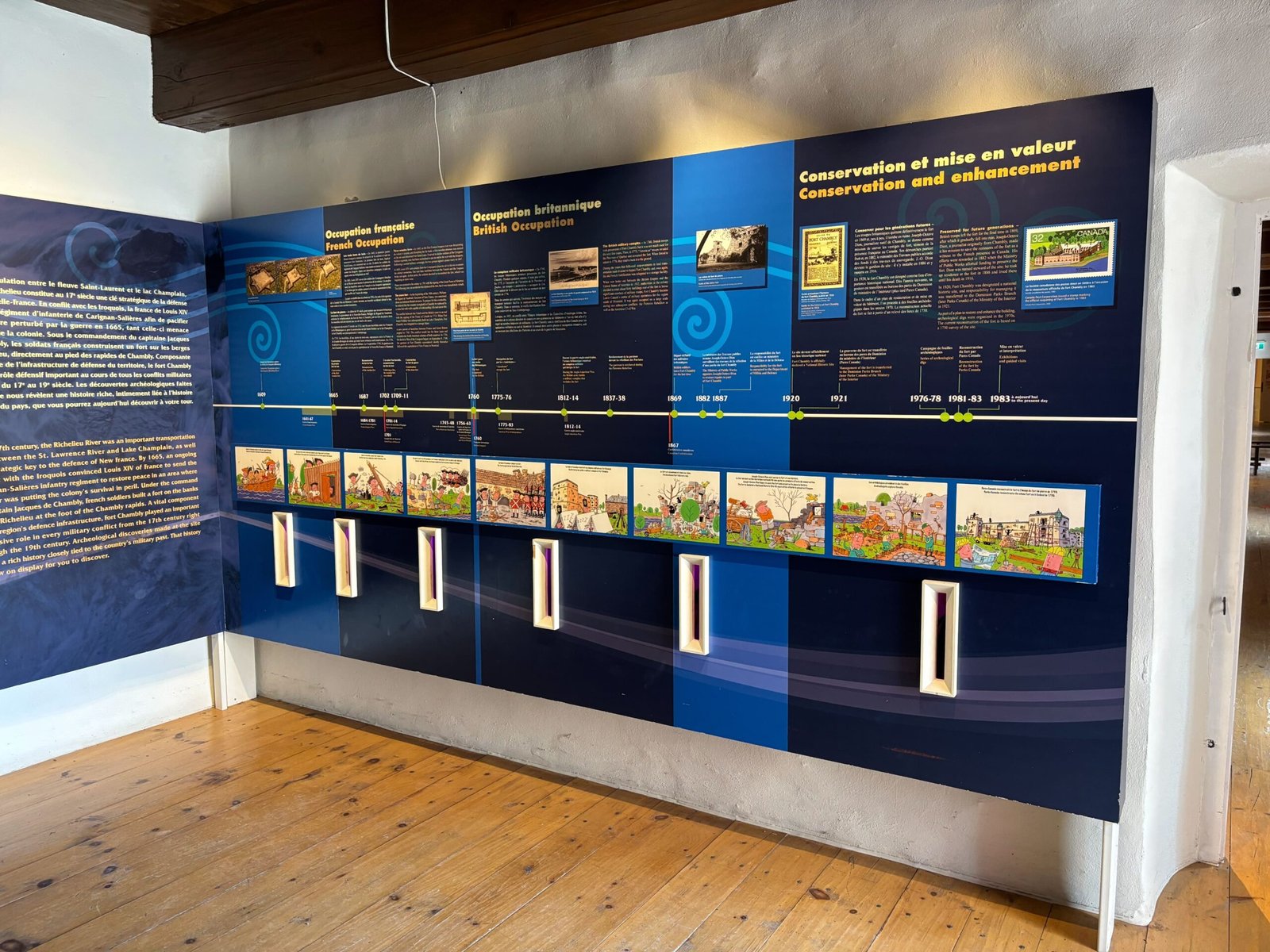 Educational panels on French and British occupation history at Fort de Chambly museum, Quebec.