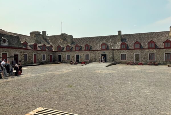 Visitors exploring the main courtyard of Fort de Chambly National Historic Site, Quebec.