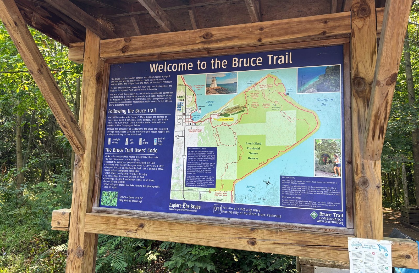 Welcome signboard for the Bruce Trail at Lion’s Head, showing trail map, park information, and hiking guidelines.